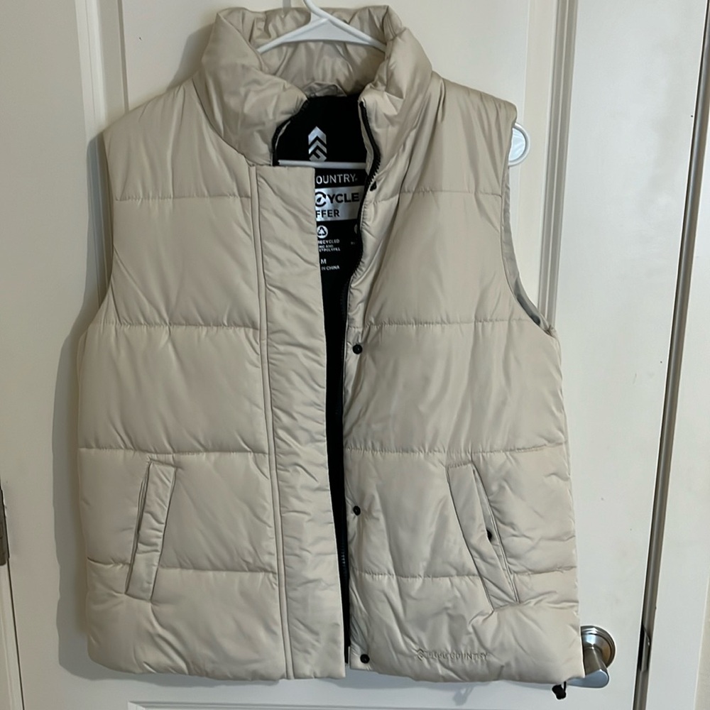 Full length, slightly oversized vest. Never worn.